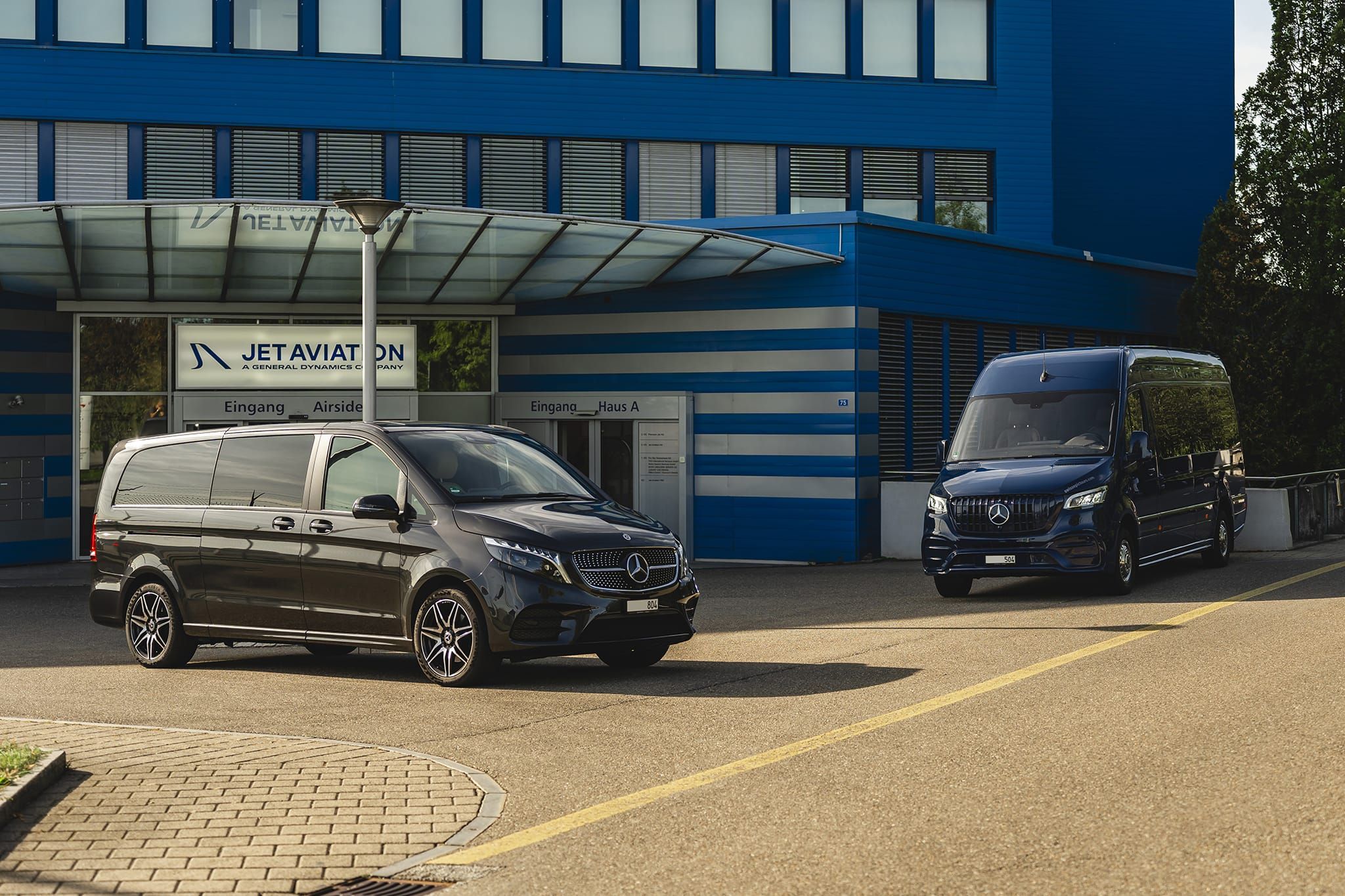 EPIC Limousines Mercedes V-Class and Sprinter outside the Jet Aviation terminal at Zurich Airport